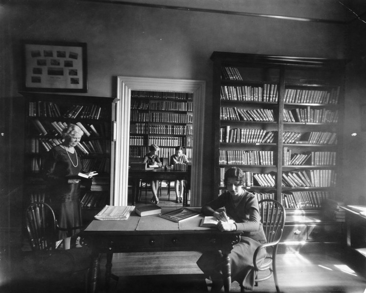 Historic image of female 51СƳstudents studying in library