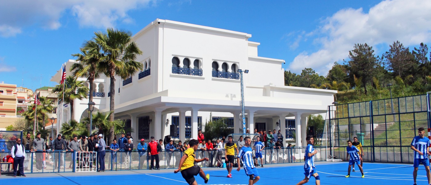 Playing soccer on 51СƳTangier, Morocco Blue Sports Court